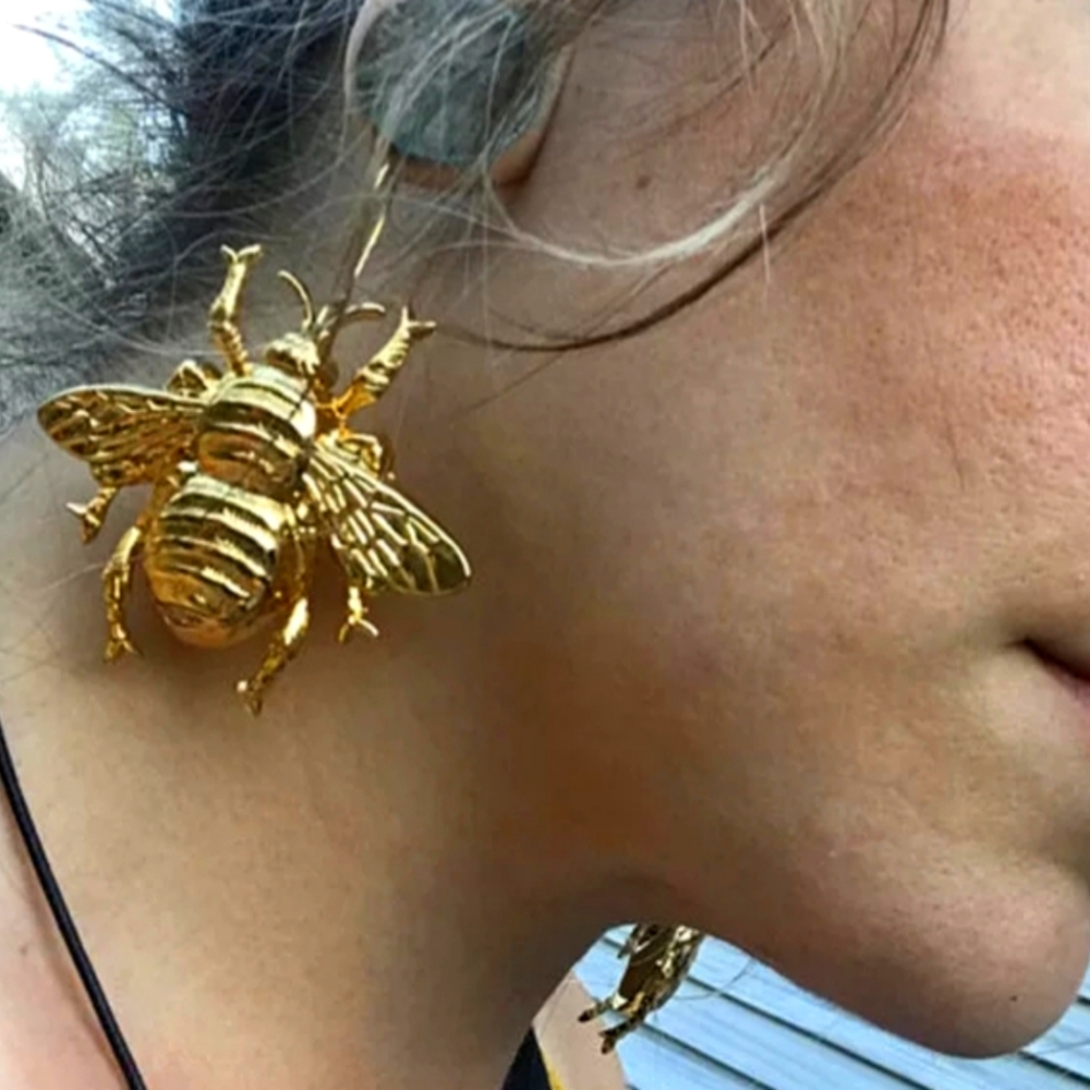 Gold tone chunky bug earrings